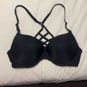 Barely worn cute Victoria padded bra with front enclosure and cross cross back